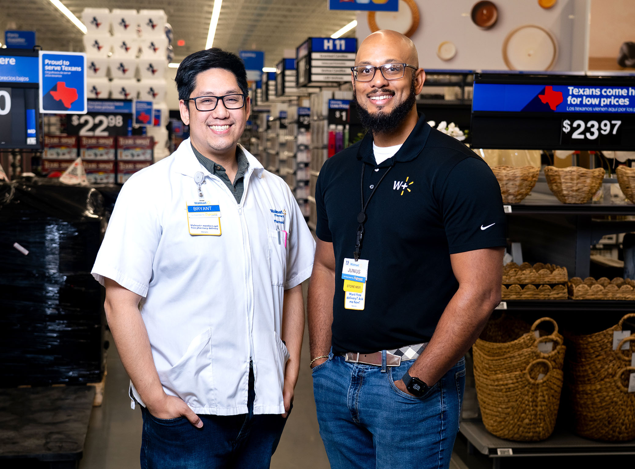 Walmart Pharmacy Manager Bryant Dao and Store Manager Junius Williams smile at camera.