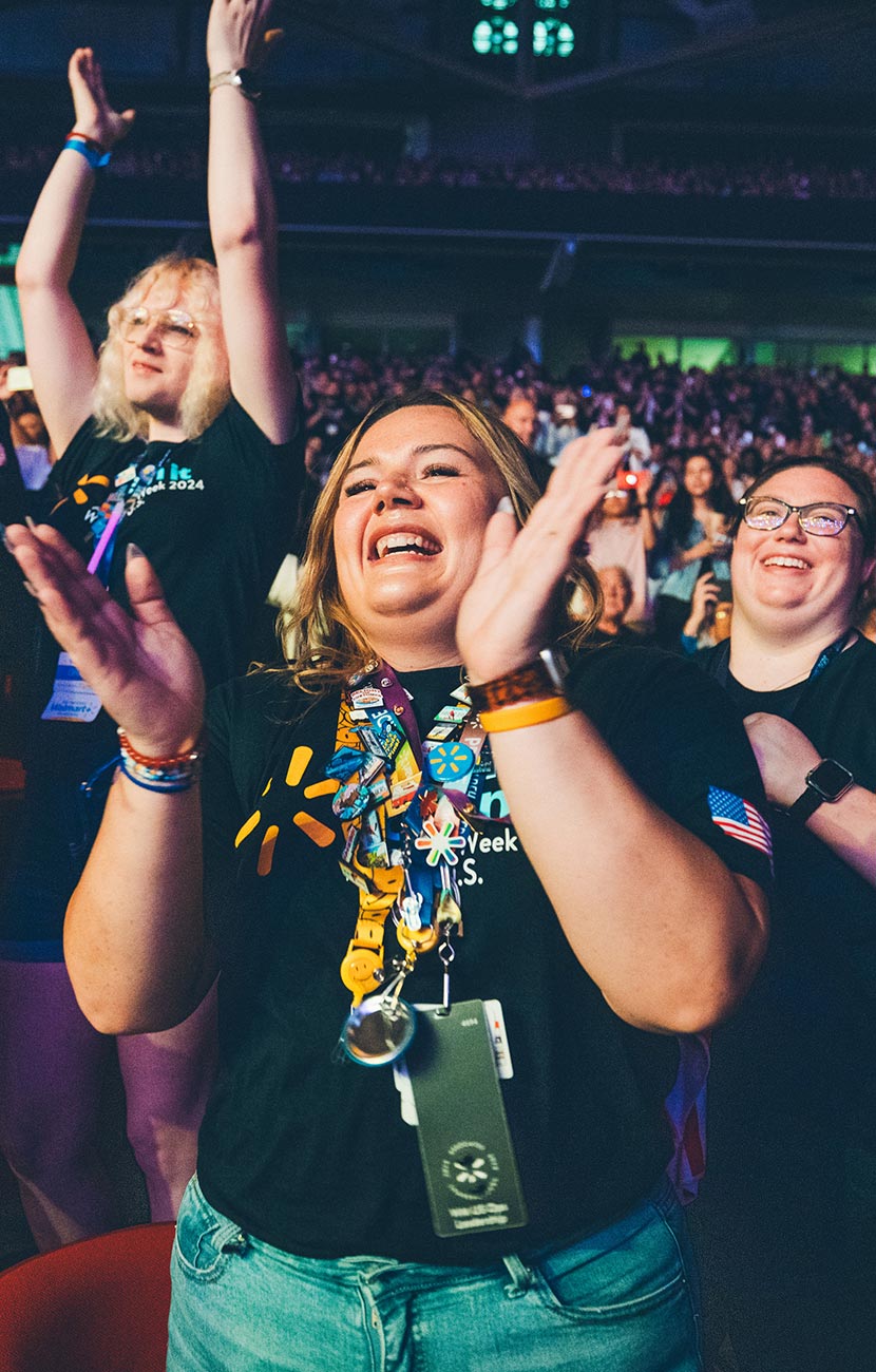 Walmart and Sam’s club associates cheer on the Associate Celebration in Bud Walton Arena in Fayetteville, Arkansas, at Associates Week 2024.