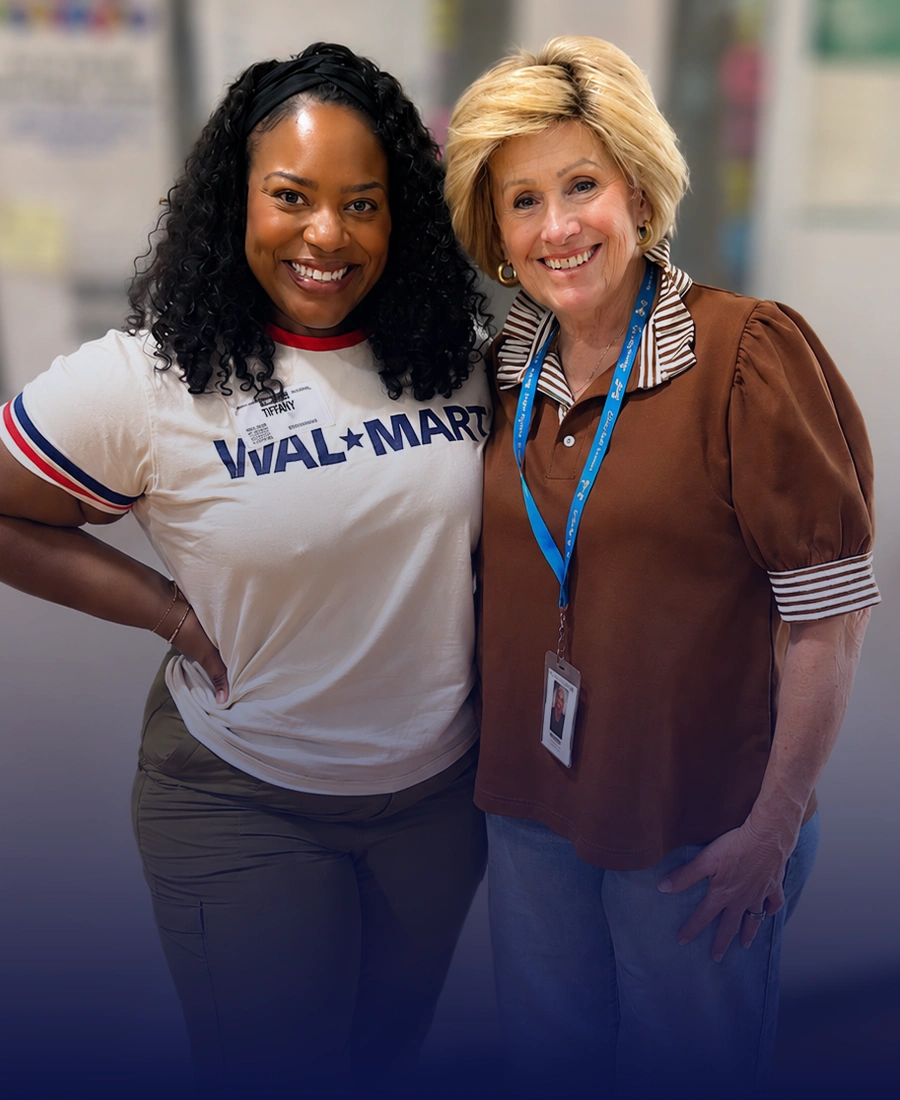 Walmart associates pose together while volunteering with Beautiful Feet Ministries