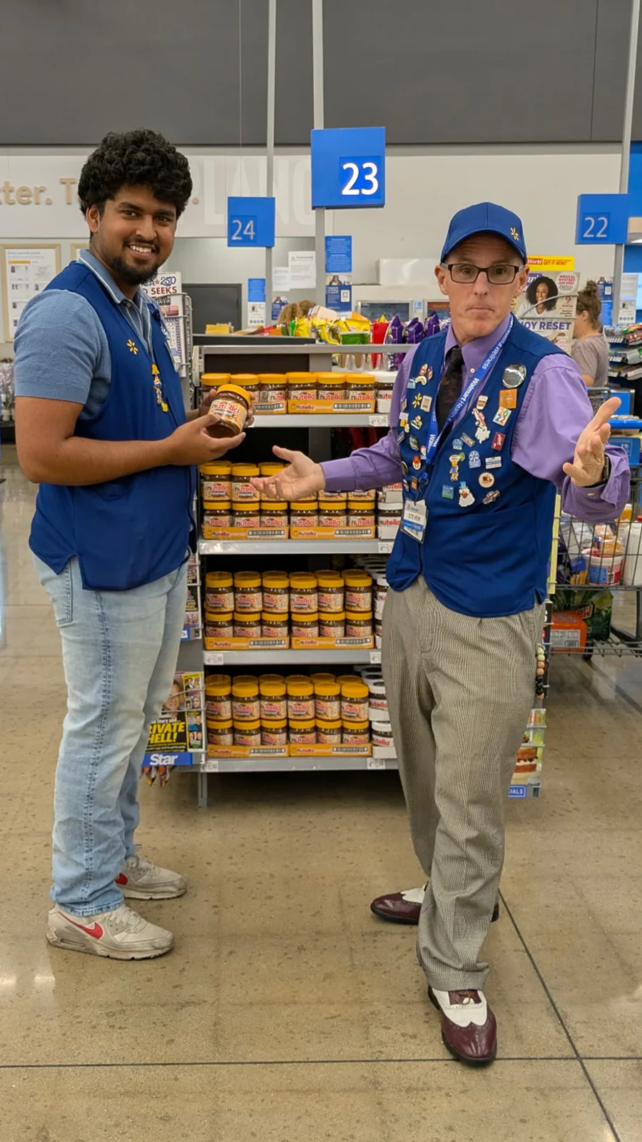Steven Harris, "That Walmart Guy," and a co-worker talk about a product in a still image from one of Steve's famous social media videos.