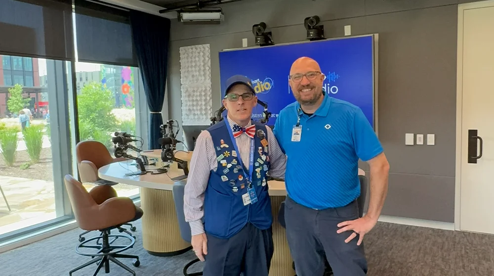 Steven Harris and Bo Woloszyn stand together in the Walmart Radio studio.