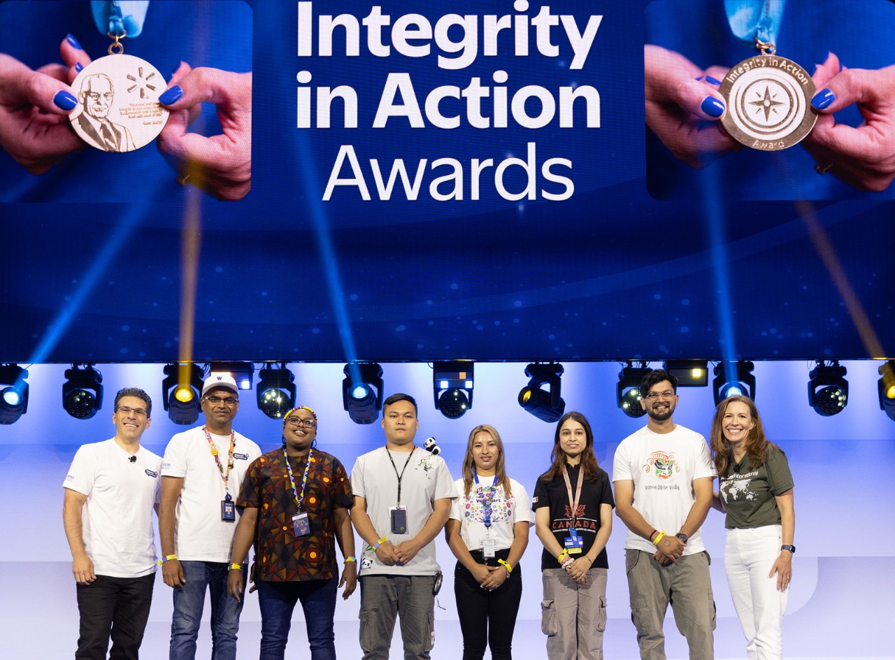 The winners of the Integrity in Action Awards smile on stage with Kath and Chris.